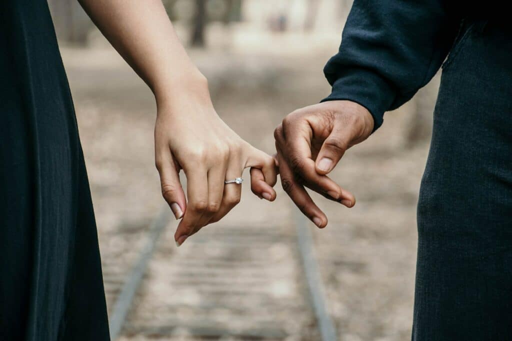 Happy Couple with Pinkies Linked